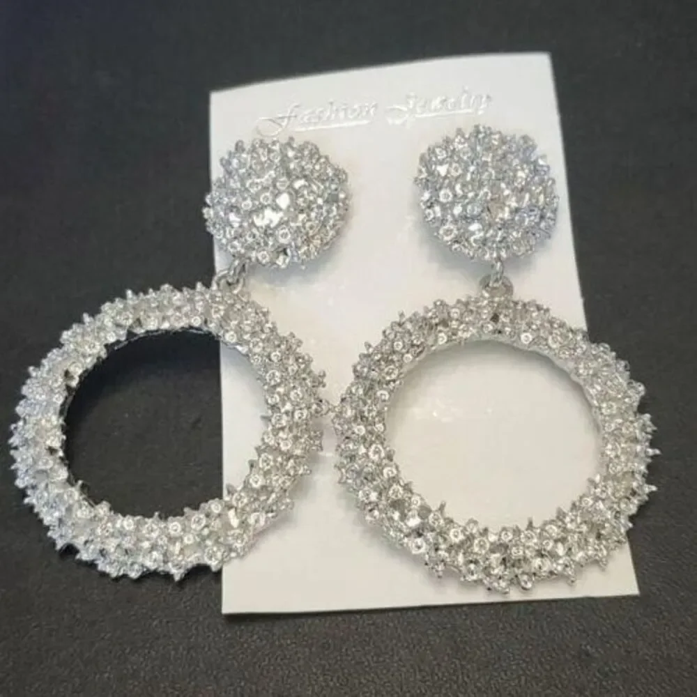 Silver tone circular themed statement earrings texture chunky